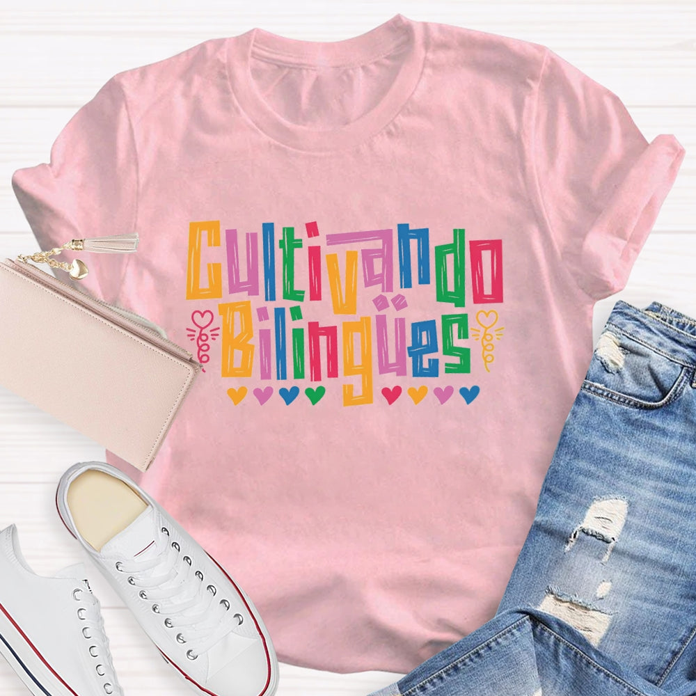 Cultivando Bilingües Bilingual Colored Heart T-shirt