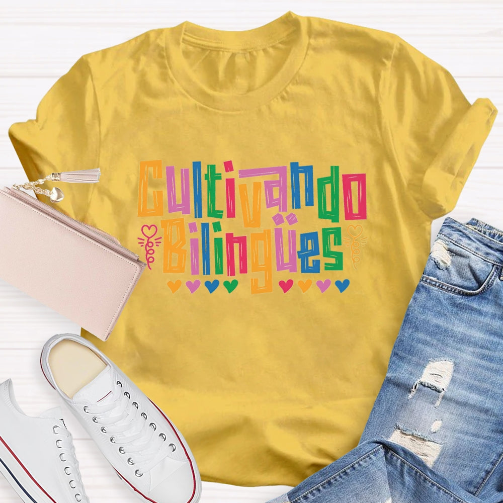 Cultivando Bilingües Bilingual Colored Heart T-shirt