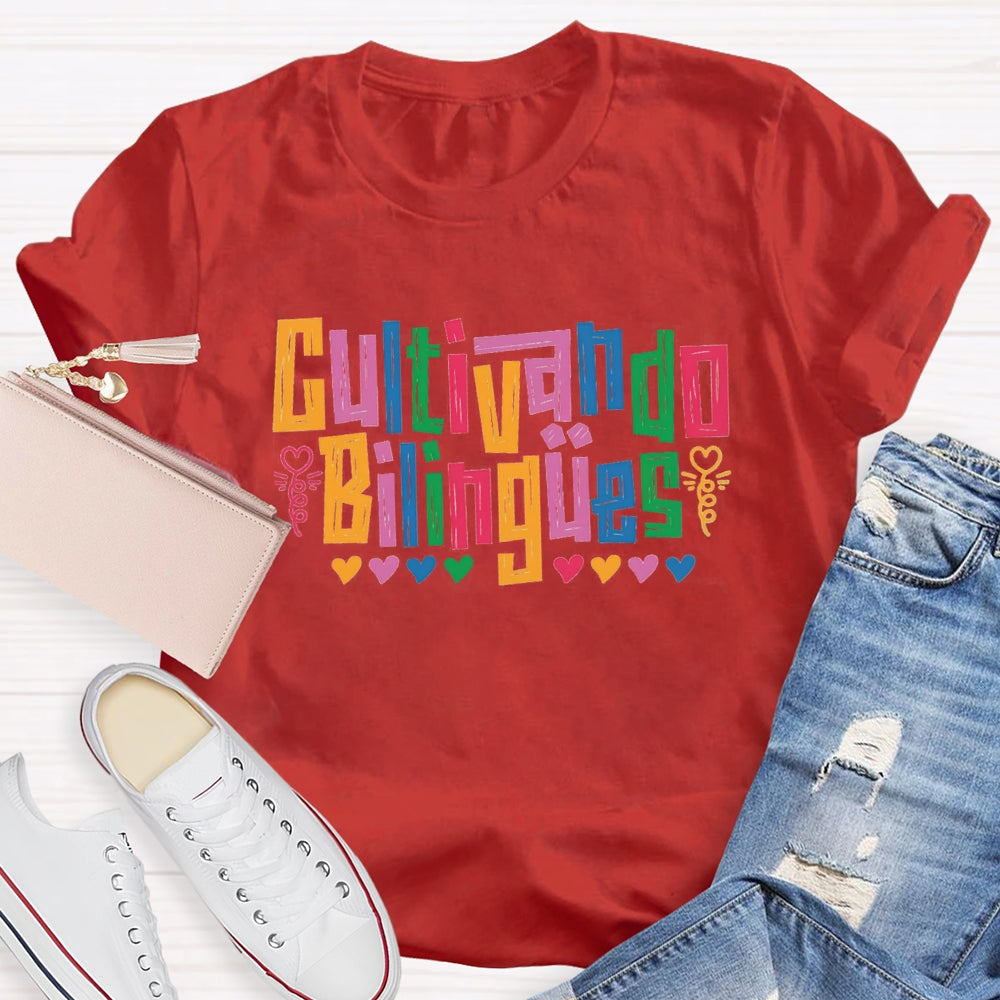 Cultivando Bilingües Bilingual Colored Heart T-shirt