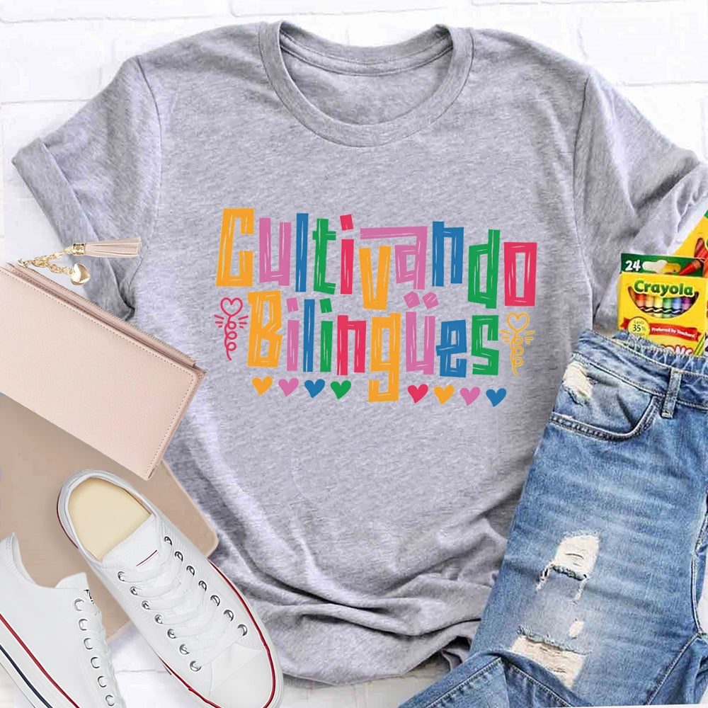 Cultivando Bilingües Bilingual Colored Heart T-shirt