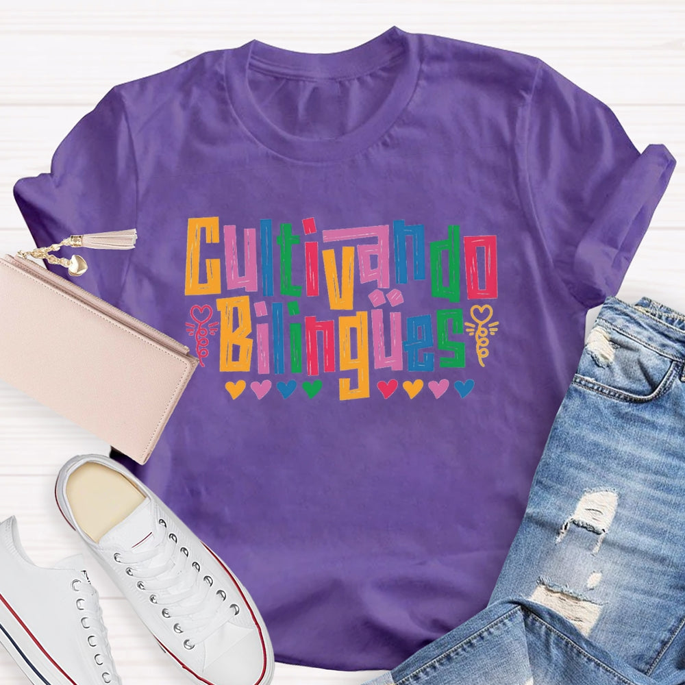 Cultivando Bilingües Bilingual Colored Heart T-shirt