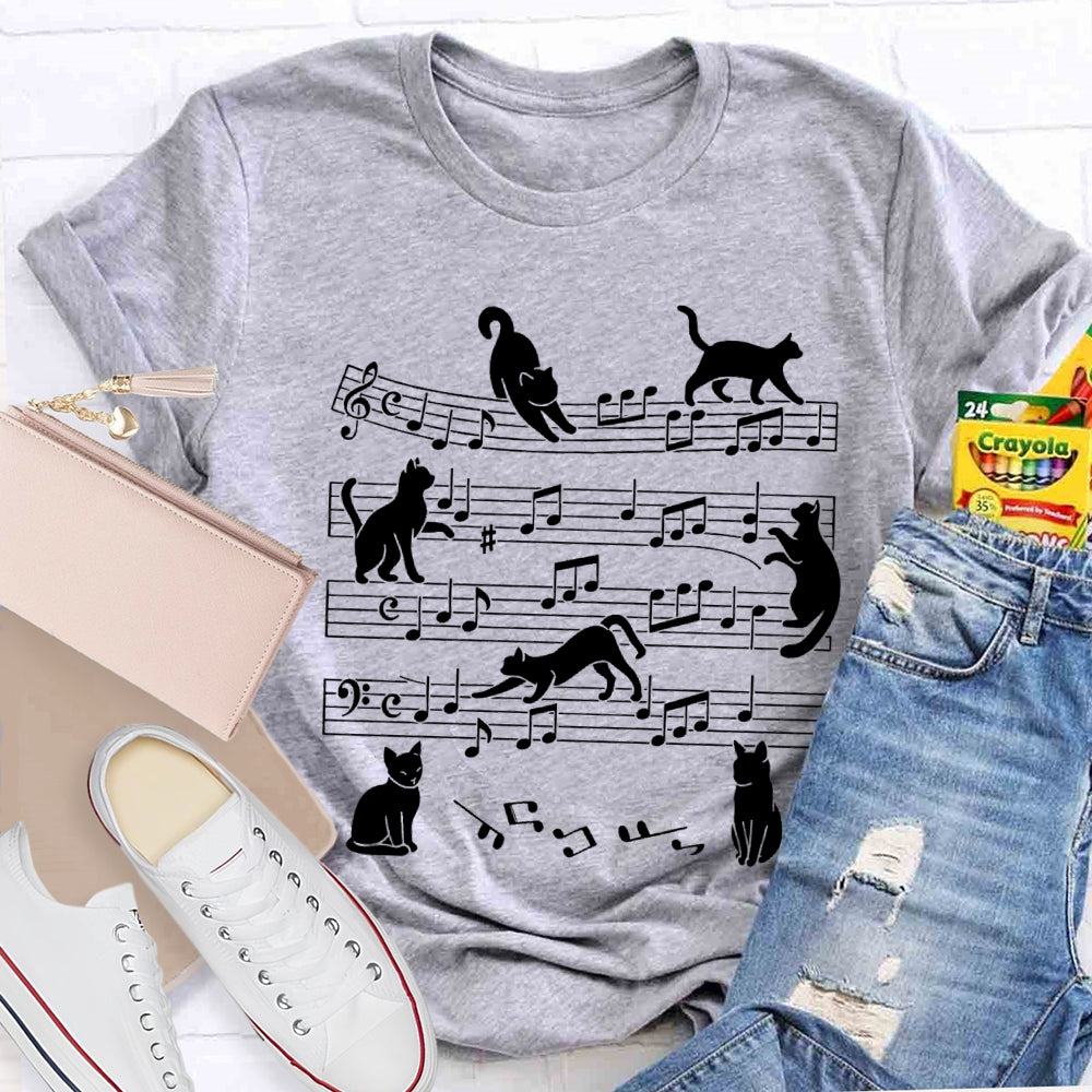 A Group Of Kittens Dancing On Musical Notes Music Teacher T-shirt