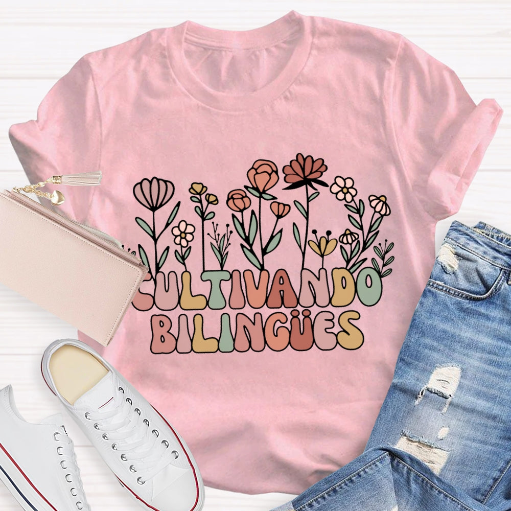 Cultivando Bilingues Colorful Fonts And Small Flowers Bilingual Teacher T-shirt