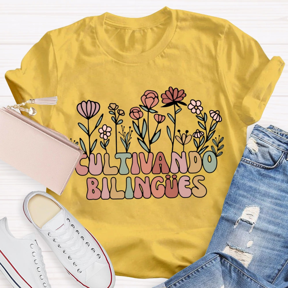 Cultivando Bilingues Colorful Fonts And Small Flowers Bilingual Teacher T-shirt