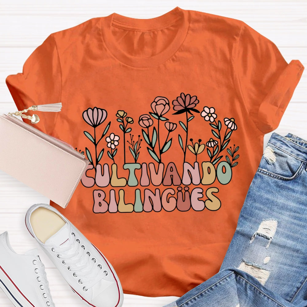 Cultivando Bilingues Colorful Fonts And Small Flowers Bilingual Teacher T-shirt