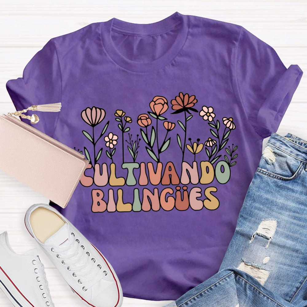 Cultivando Bilingues Colorful Fonts And Small Flowers Bilingual Teacher T-shirt