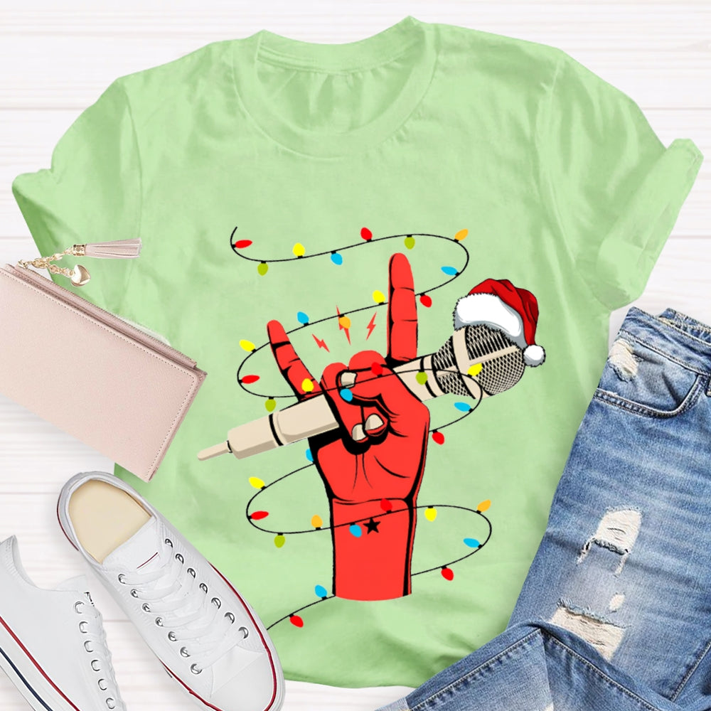 Holding A Microphone Wearing A Santa Hat And Christmas Lights T-shirt