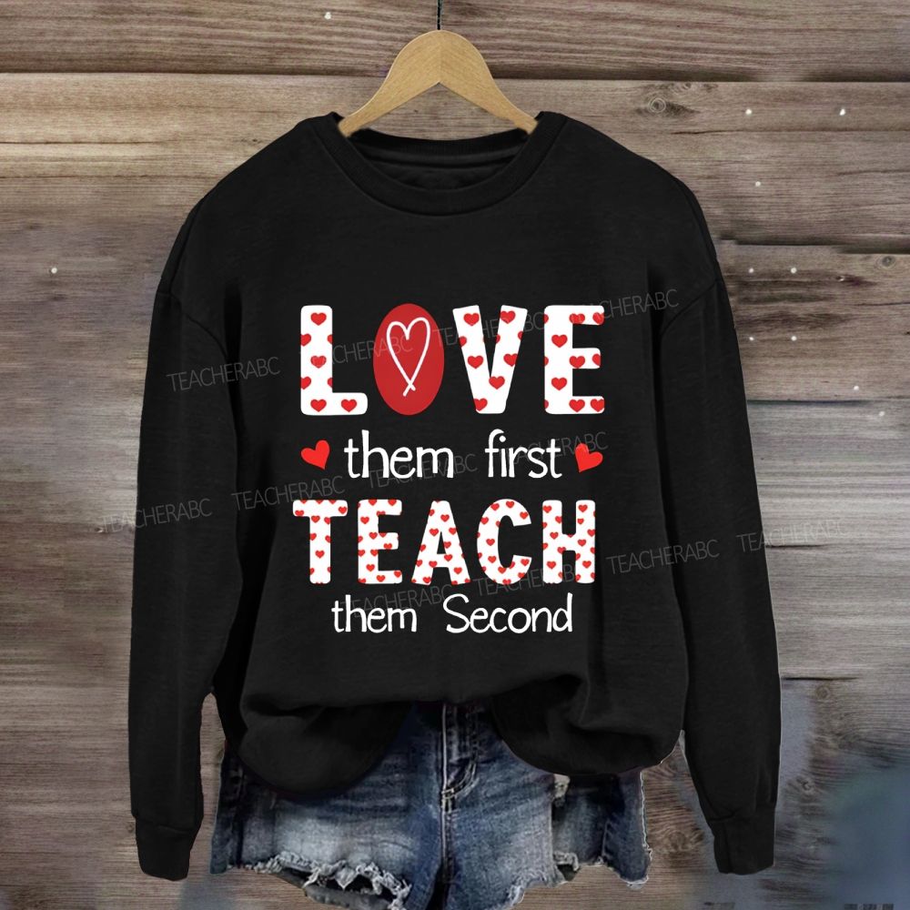 Red Heart Love Them First Teach Them Second Sweatshirt