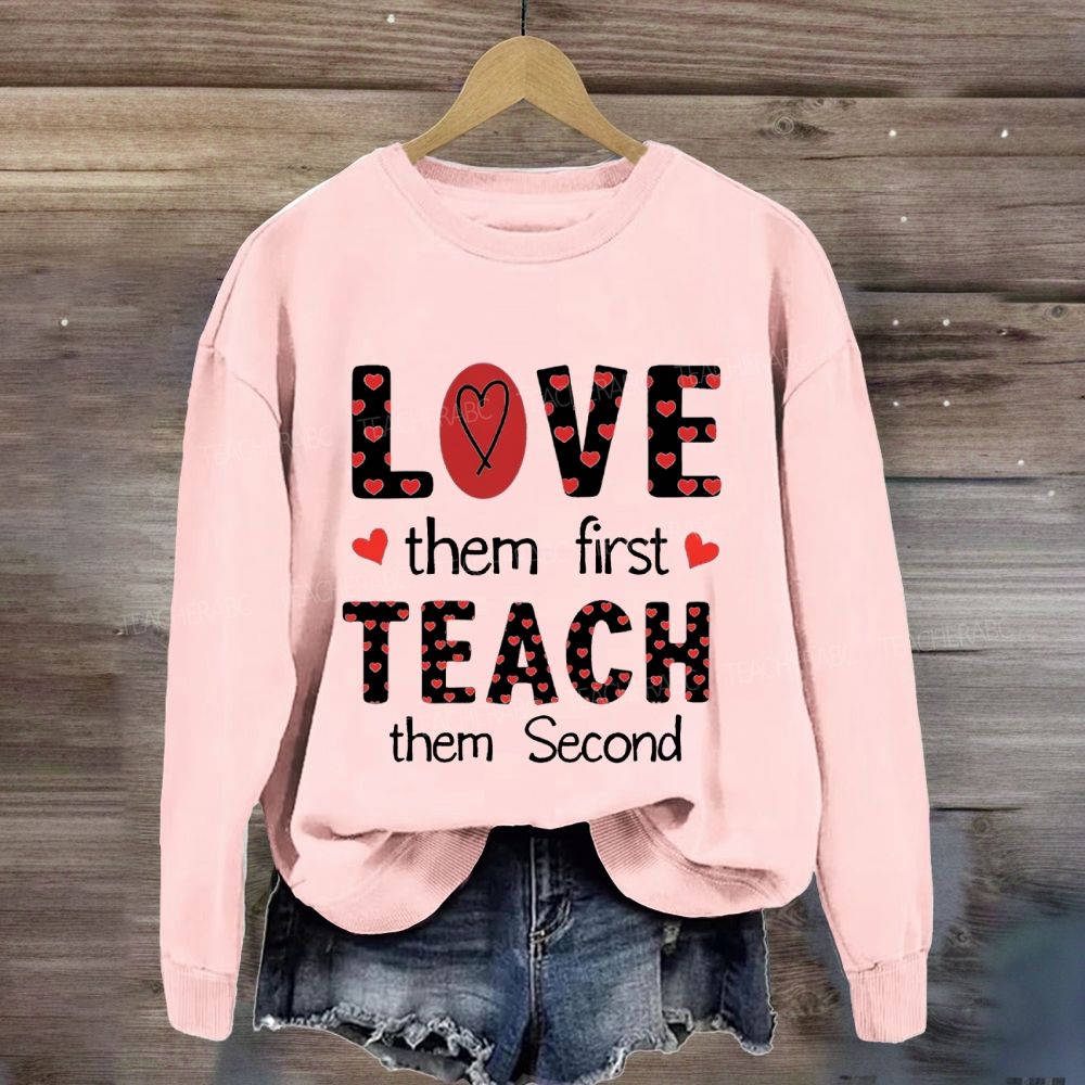 Red Heart Love Them First Teach Them Second Sweatshirt