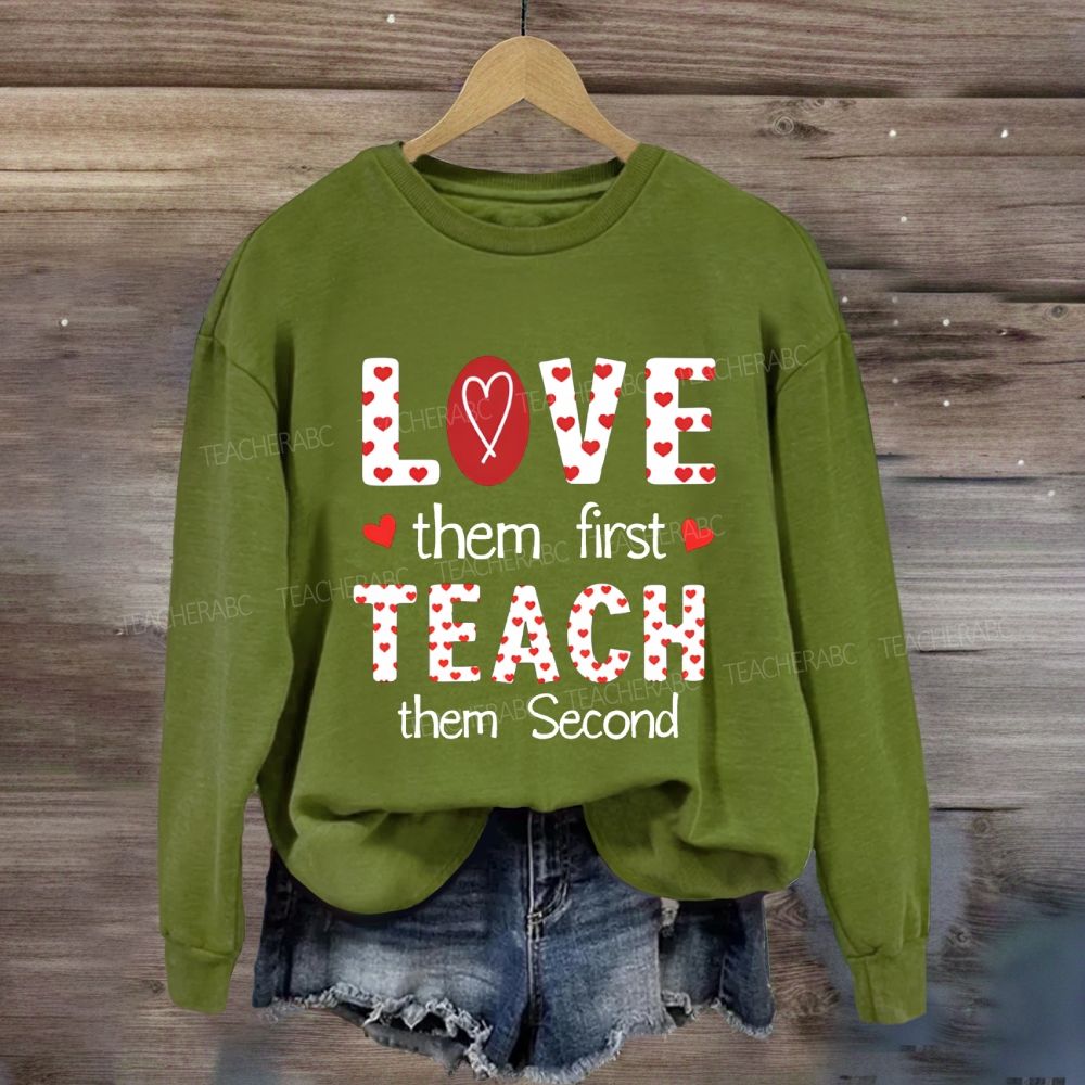 Red Heart Love Them First Teach Them Second Sweatshirt