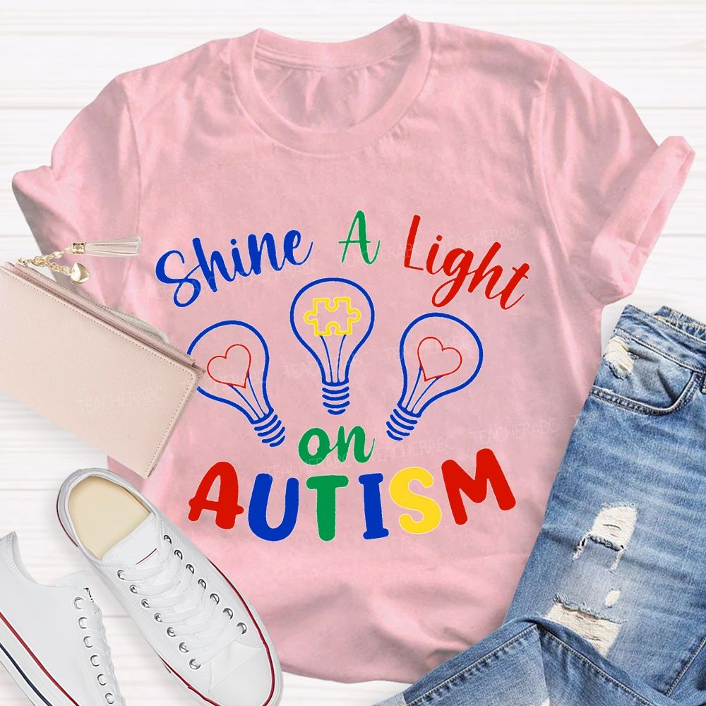 Shine A Light Autism Colored Lettering And Light Bulbs T-shirt