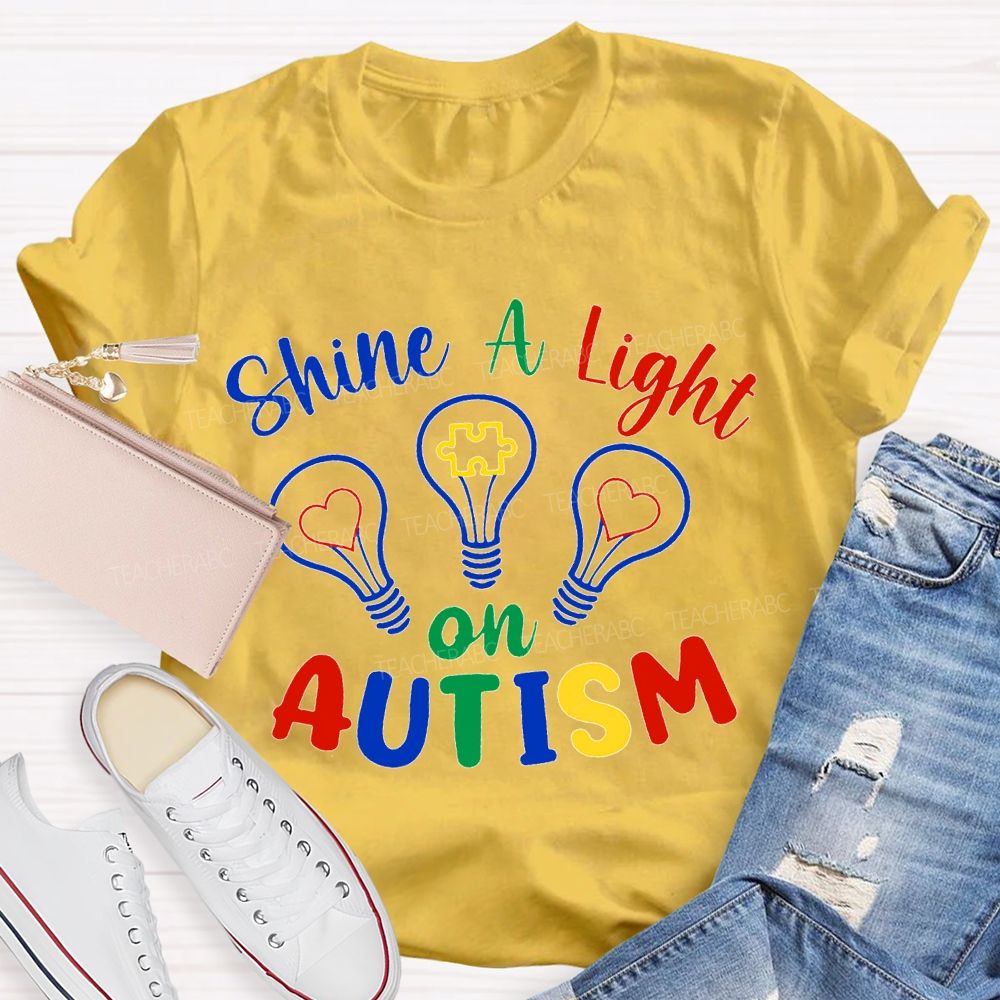 Shine A Light Autism Colored Lettering And Light Bulbs T-shirt