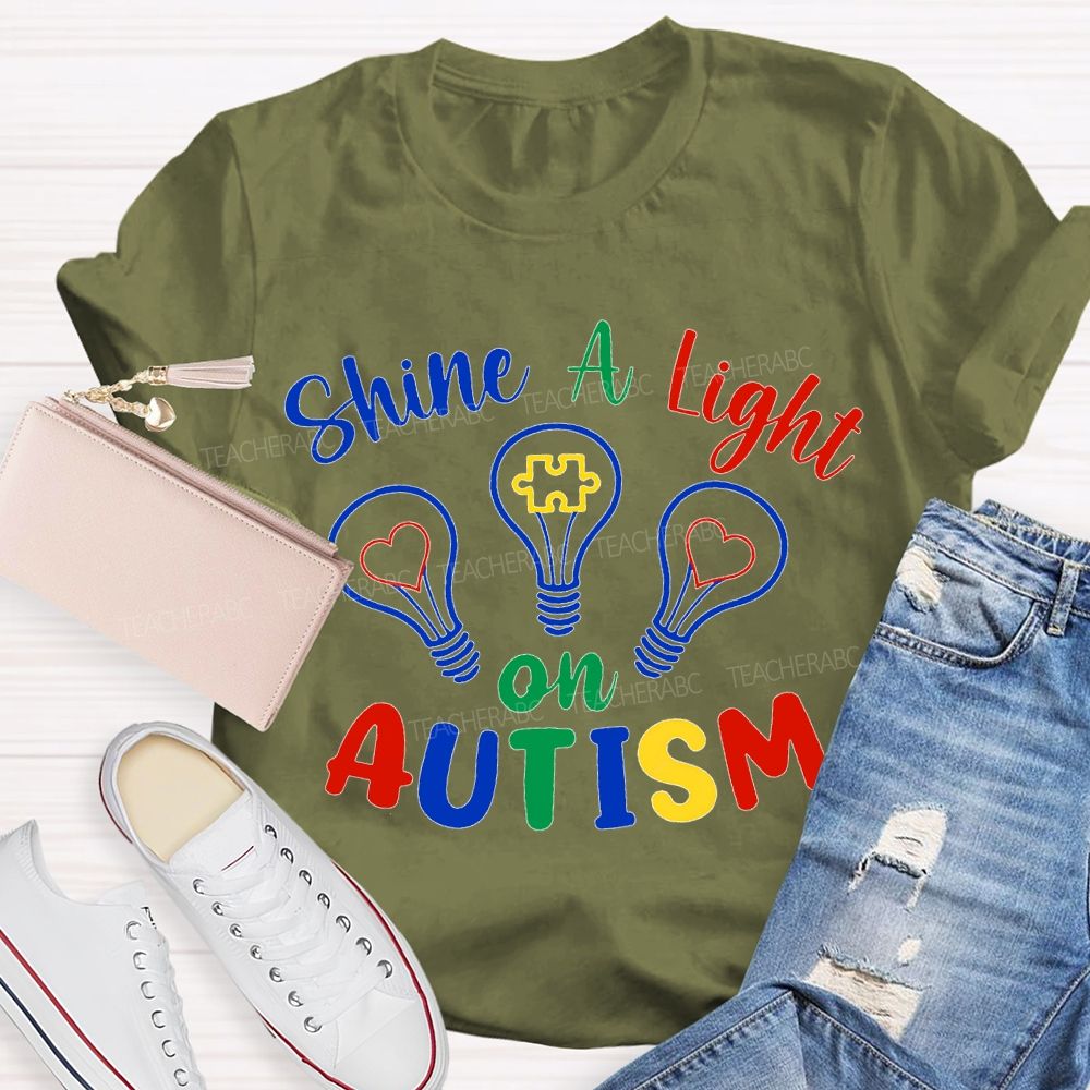 Shine A Light Autism Colored Lettering And Light Bulbs T-shirt