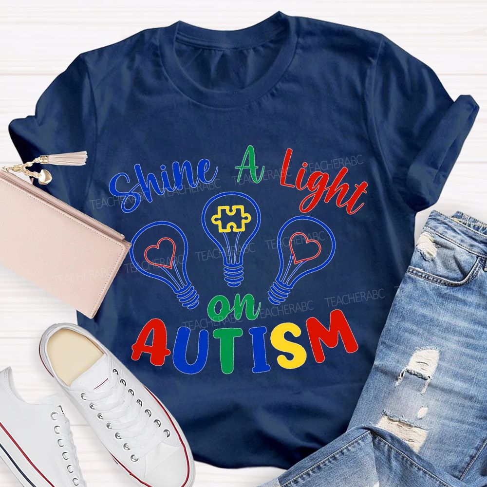 Shine A Light Autism Colored Lettering And Light Bulbs T-shirt