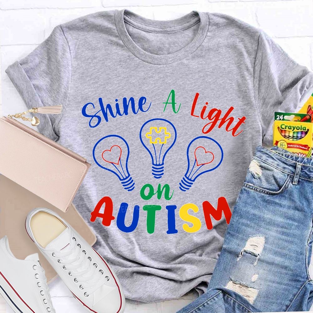 Shine A Light Autism Colored Lettering And Light Bulbs T-shirt