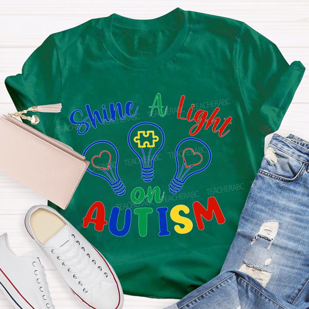 Shine A Light Autism Colored Lettering And Light Bulbs T-shirt