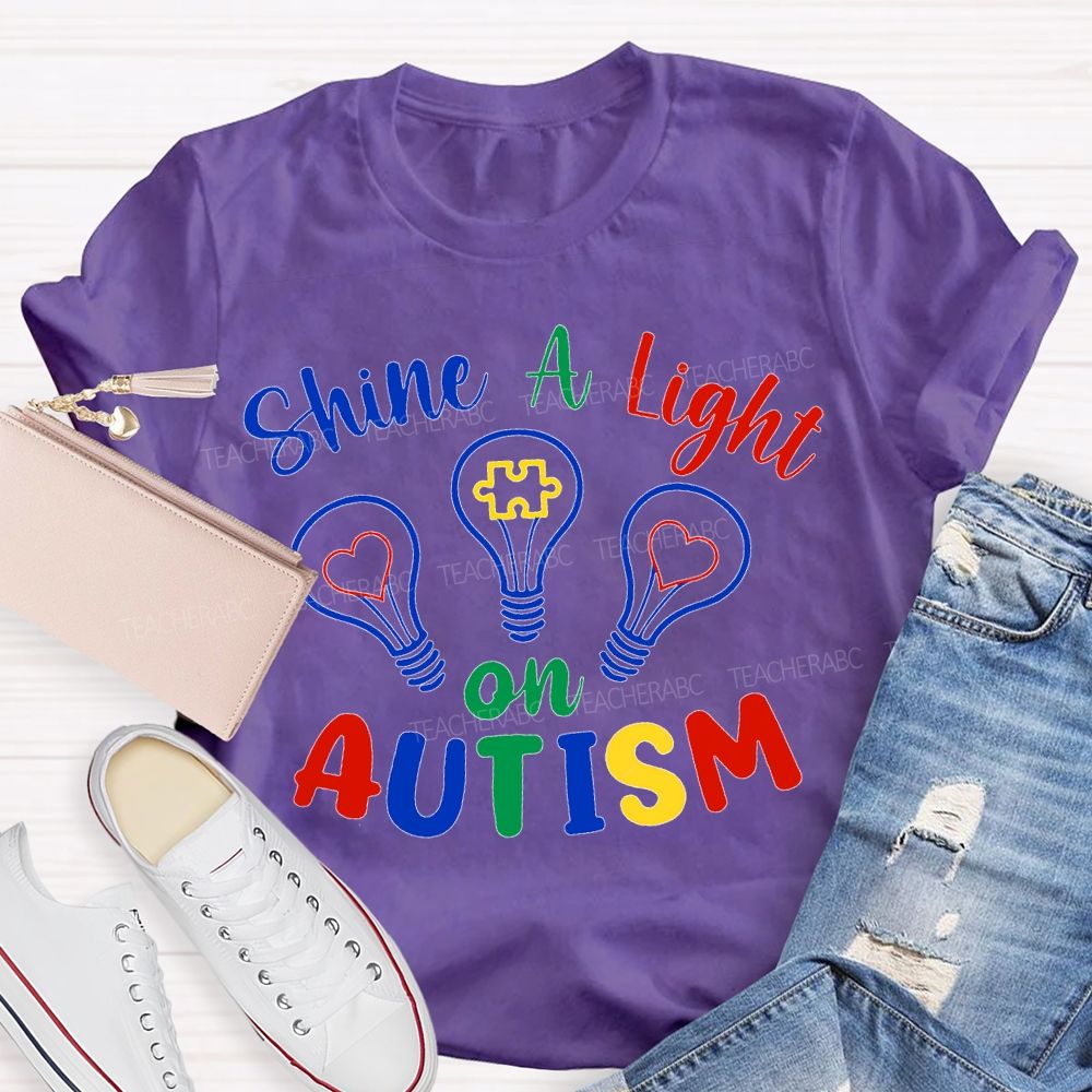 Shine A Light Autism Colored Lettering And Light Bulbs T-shirt