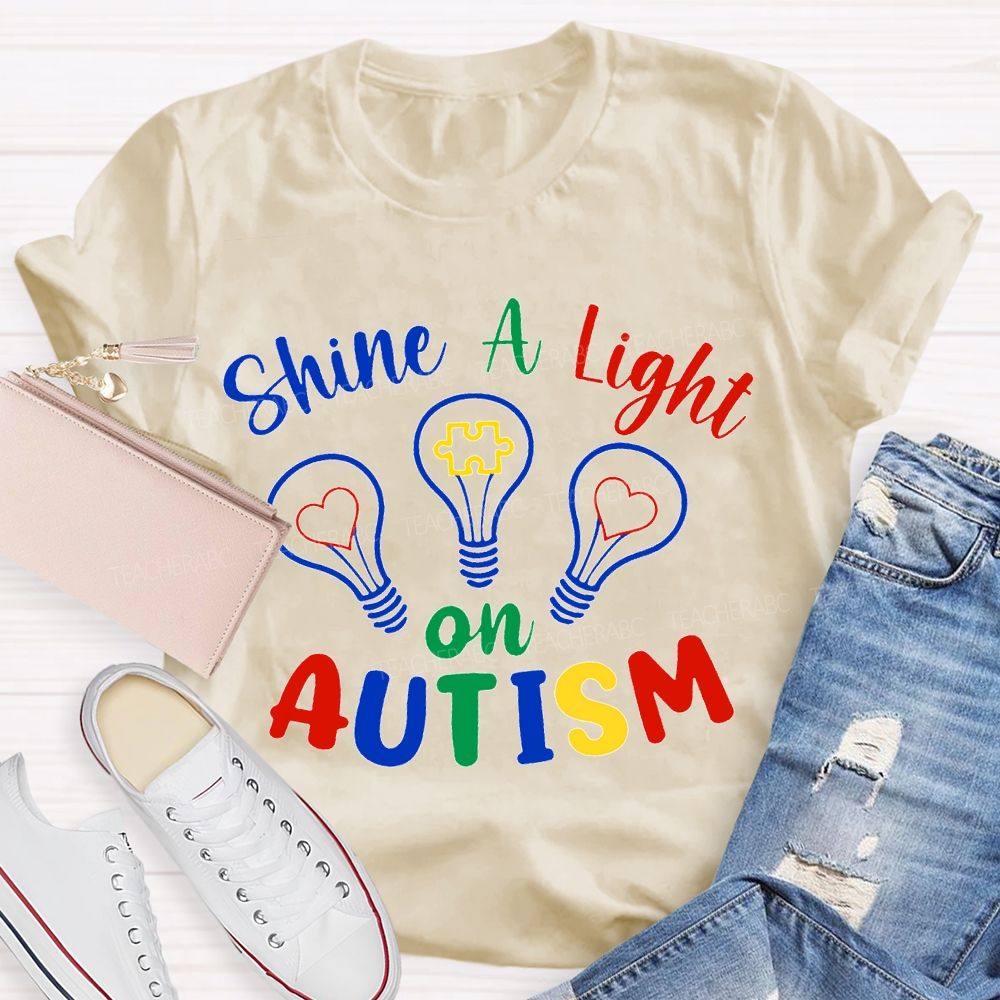 Shine A Light Autism Colored Lettering And Light Bulbs T-shirt