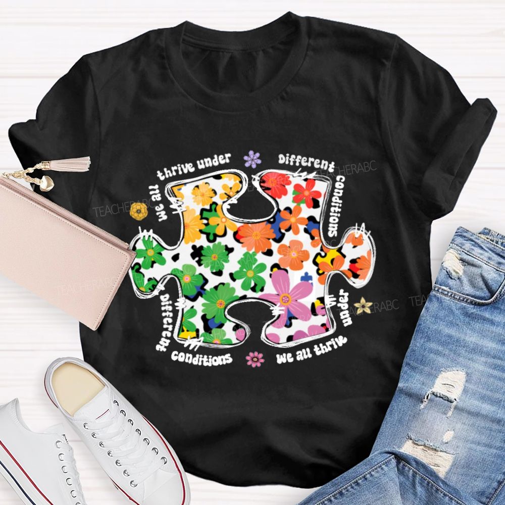 We Are Thrive Under Different Conditions Flowers Puzzle Teacher T-shirt