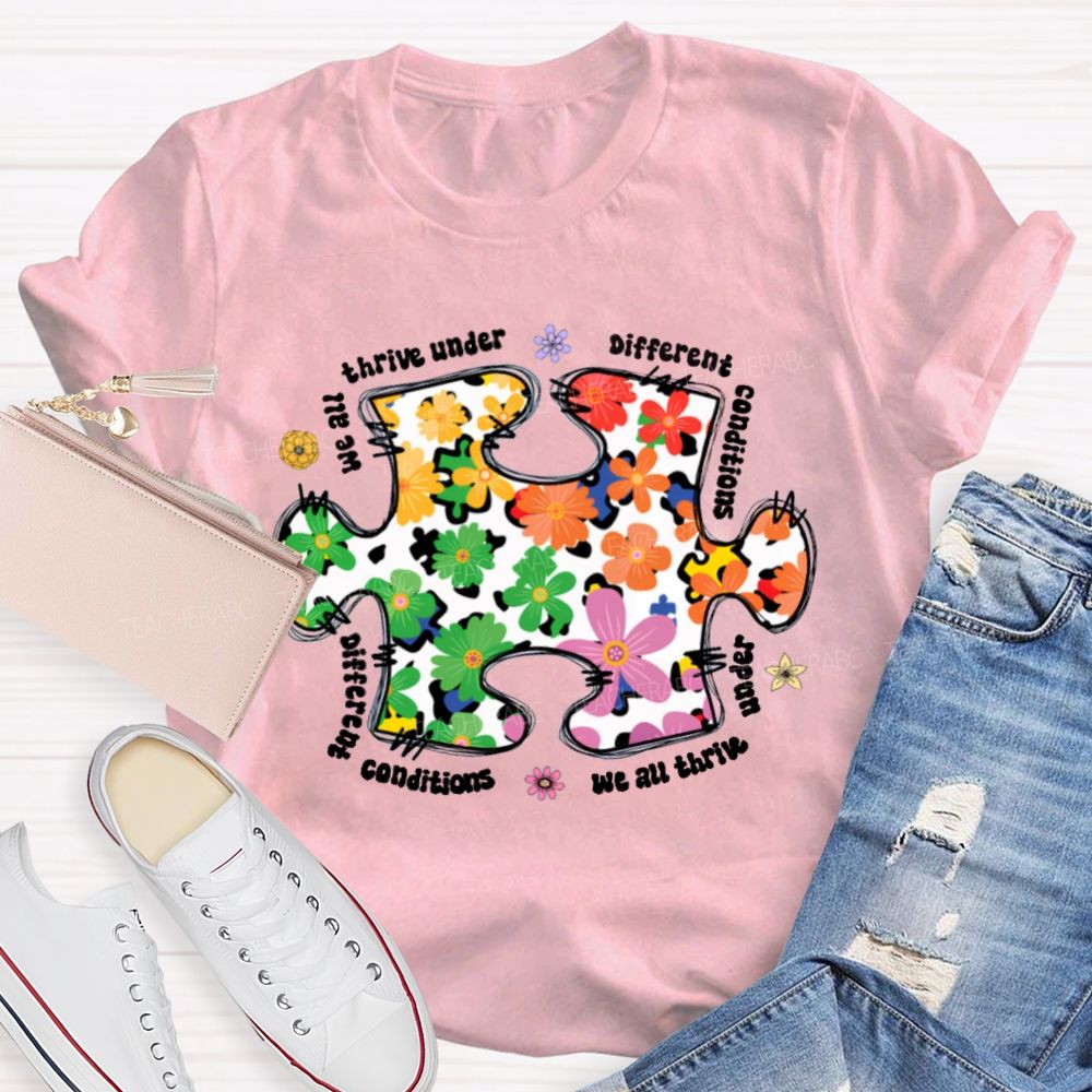 We Are Thrive Under Different Conditions Flowers Puzzle Teacher T-shirt