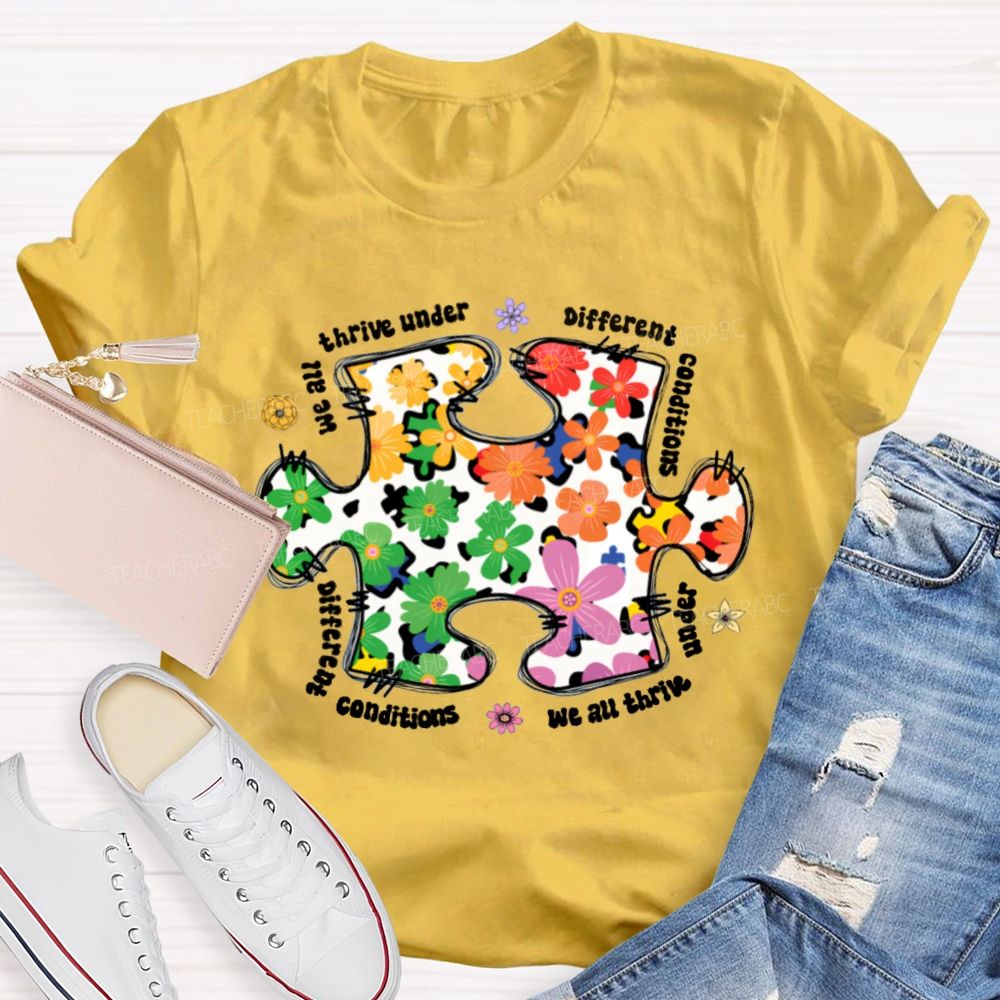 We Are Thrive Under Different Conditions Flowers Puzzle Teacher T-shirt