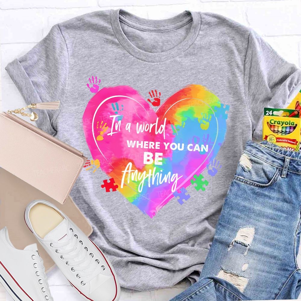 In A World Where You Can Be Anything Colorful Handprint Teacher T-shirt