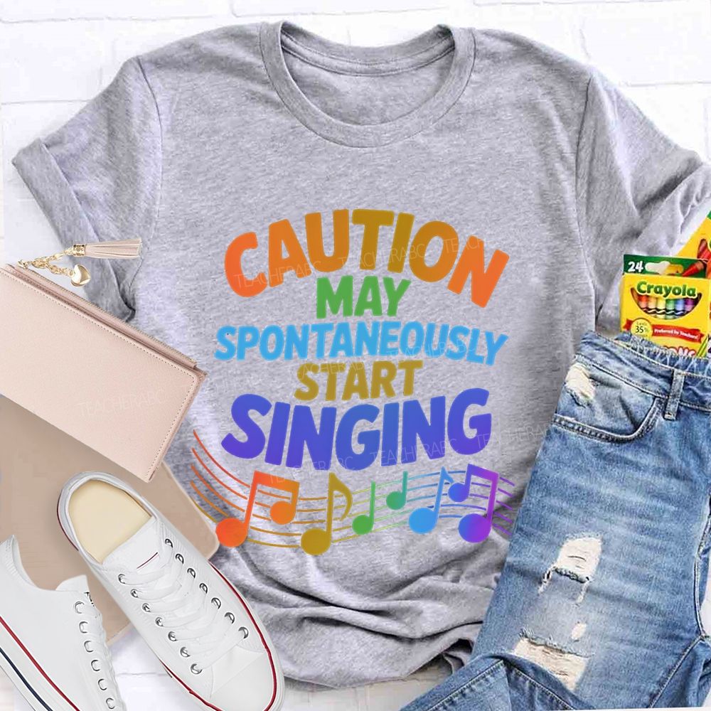 Caution May Spontaneously Start Singing Colorful Letters Teacher T-shirt