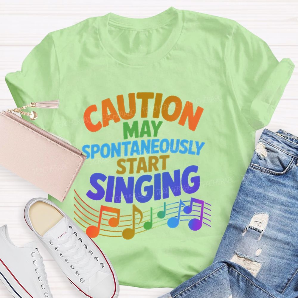 Caution May Spontaneously Start Singing Colorful Letters Teacher T-shirt