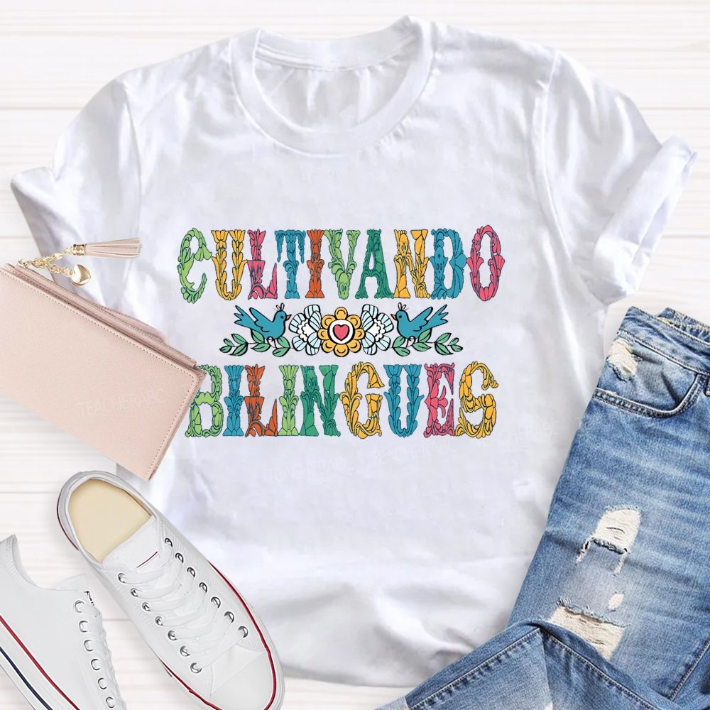 Cultivando Bilingues Colorful Letters Teacher T-shirt