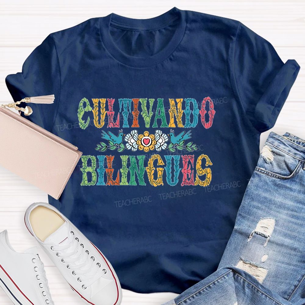 Cultivando Bilingues Colorful Letters Teacher T-shirt