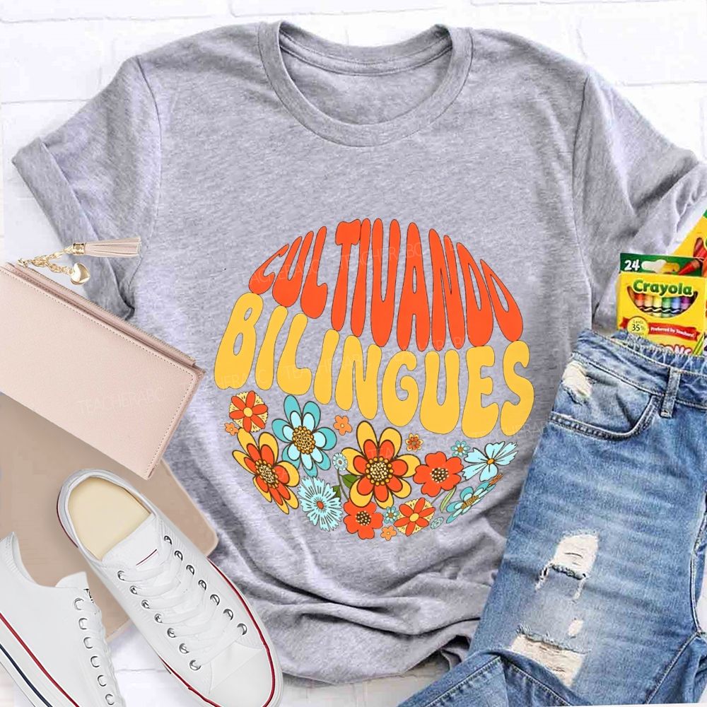 Cultivando Bilingues And Colorful Flowers Teacher T-shirt
