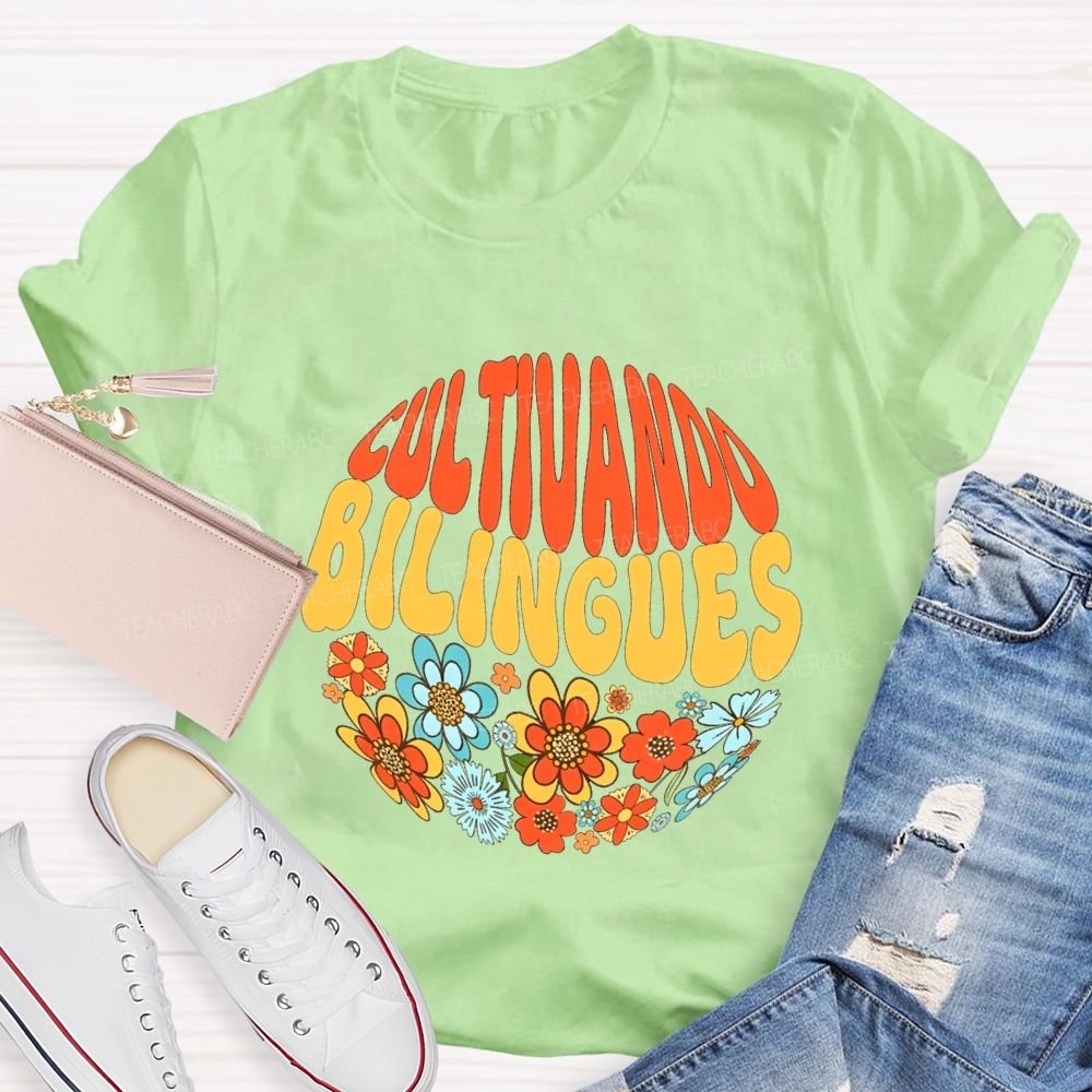 Cultivando Bilingues And Colorful Flowers Teacher T-shirt