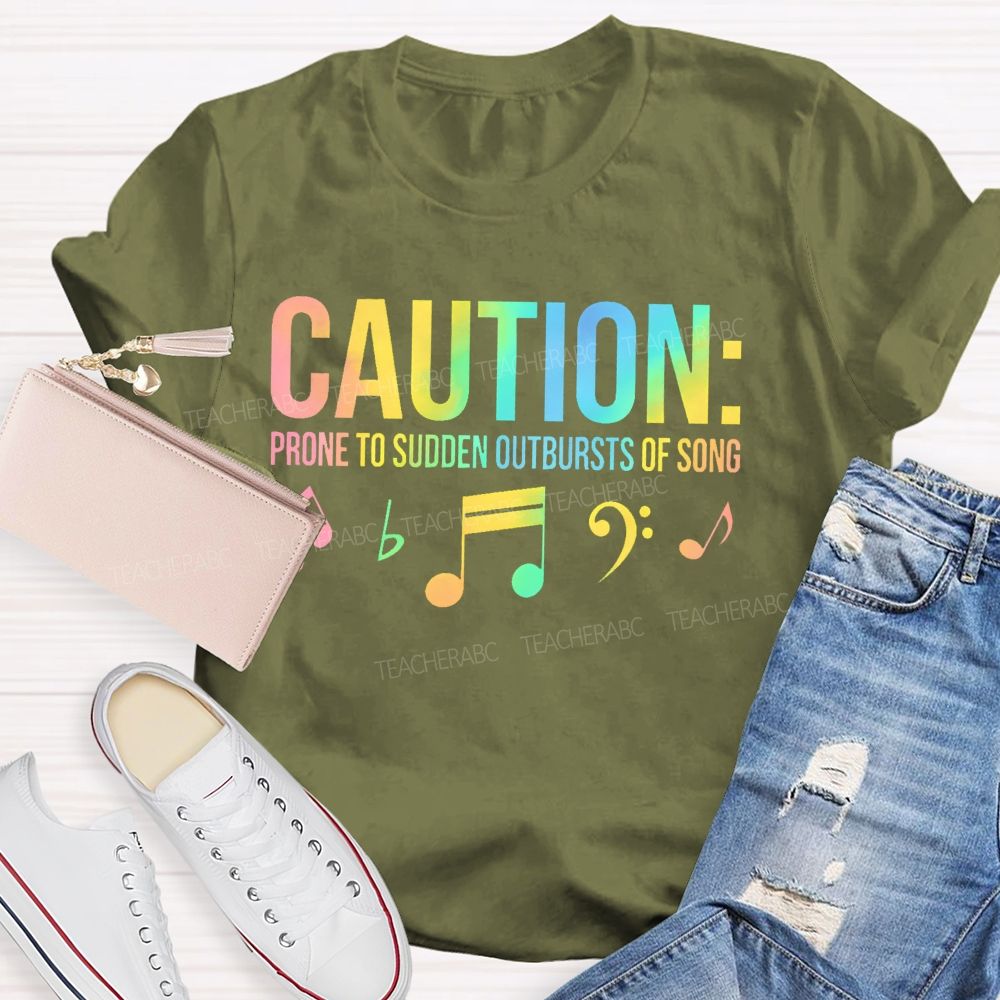 Caution Prone To Sudden Outbursts Of Song Colorful Letters Teacher T-shirt