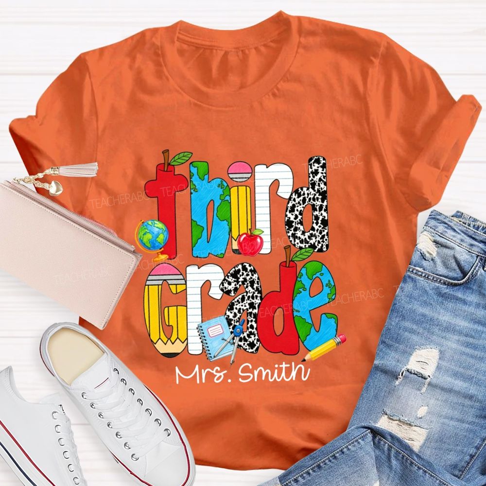 Personalized Name And Grade Cow Print And School‑Supply Doodle Teacher T-shirt