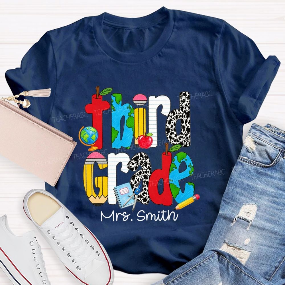 Personalized Name And Grade Cow Print And School‑Supply Doodle Teacher T-shirt