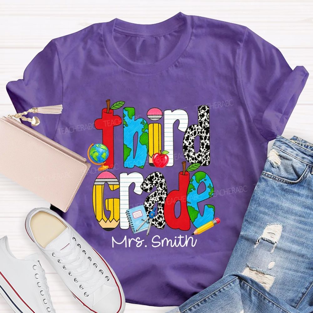 Personalized Name And Grade Cow Print And School‑Supply Doodle Teacher T-shirt