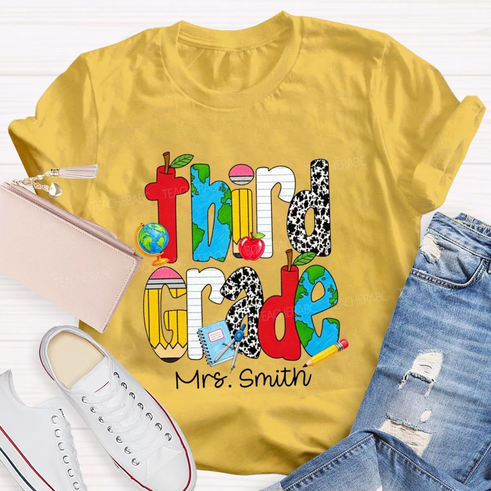 Personalized Name And Grade Cow Print And School‑Supply Doodle Teacher T-shirt