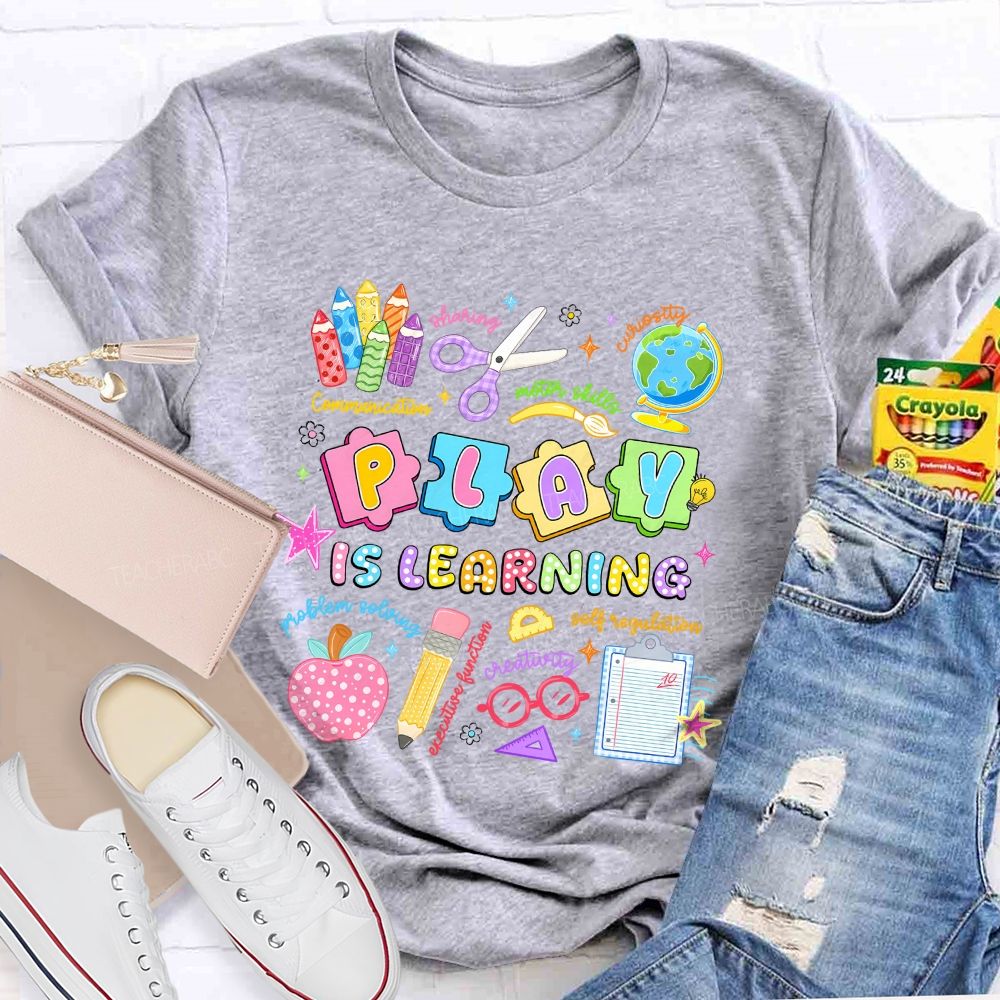 Play Is Learning Sharing Curiosity Motor Skills Communication Problem Solving Teacher T-shirt
