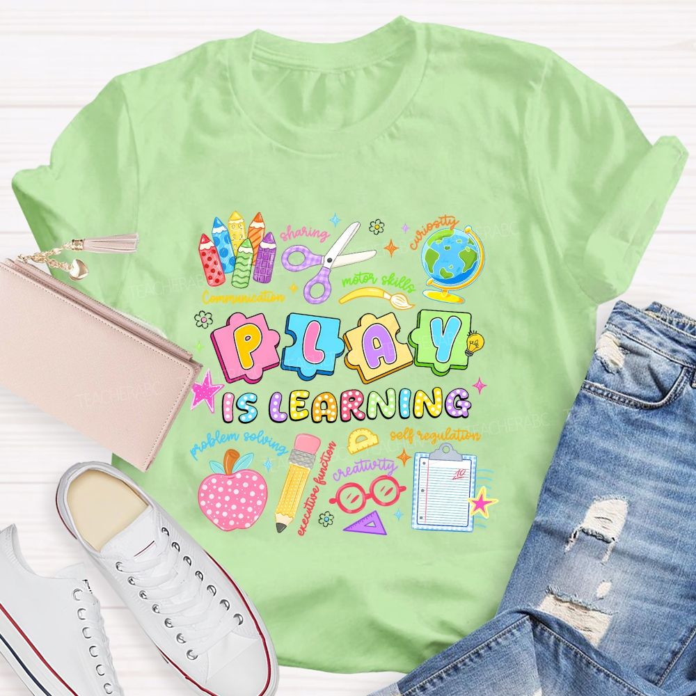 Play Is Learning Sharing Curiosity Motor Skills Communication Problem Solving Teacher T-shirt