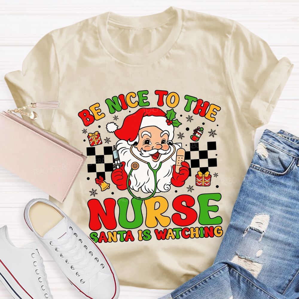 Be Nice To The Nurse Santa Is Watching Santa Claus With A Stethoscope Teacher T-shirt