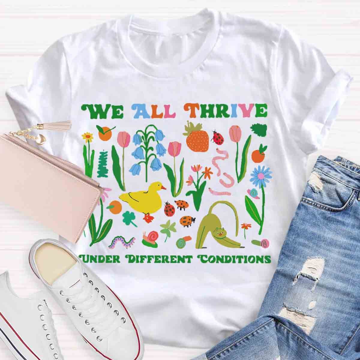 We All Thrive Under Different Conditions Teacher T-Shirt