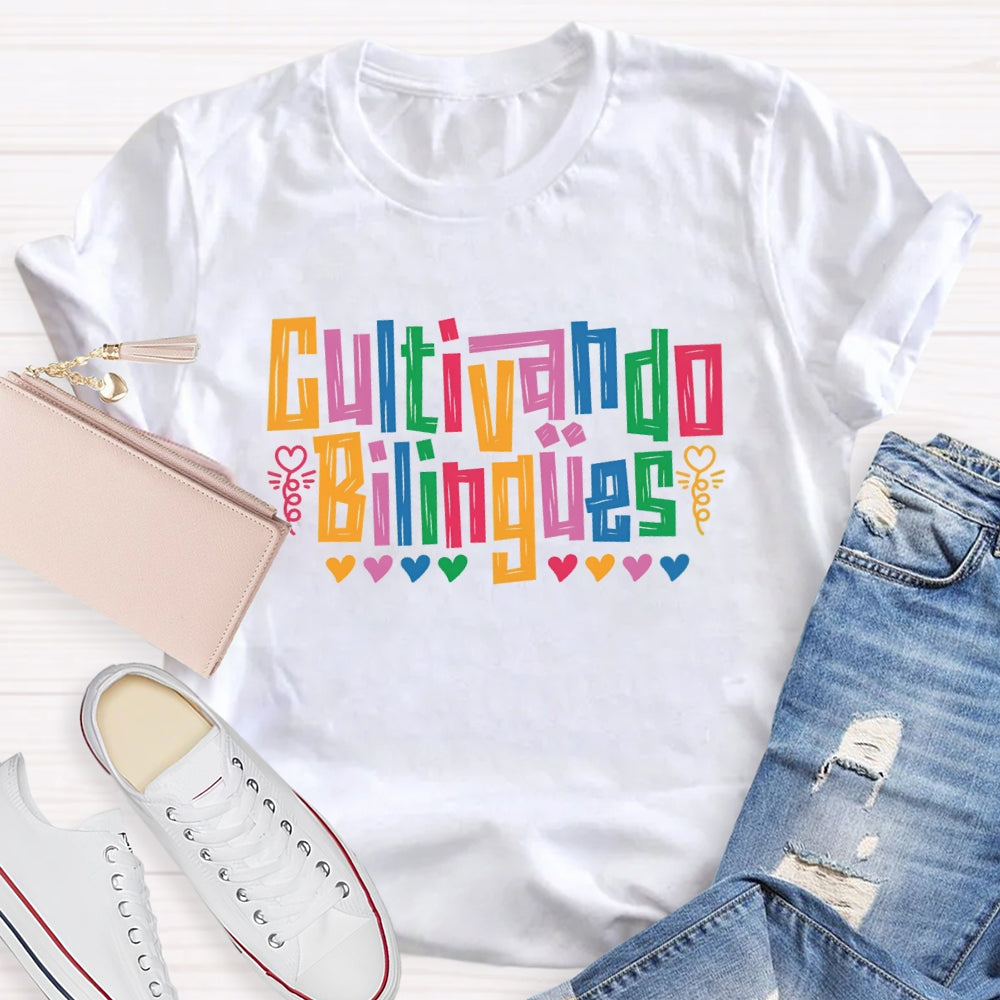 Cultivando Bilingües Bilingual Colored Heart T-shirt