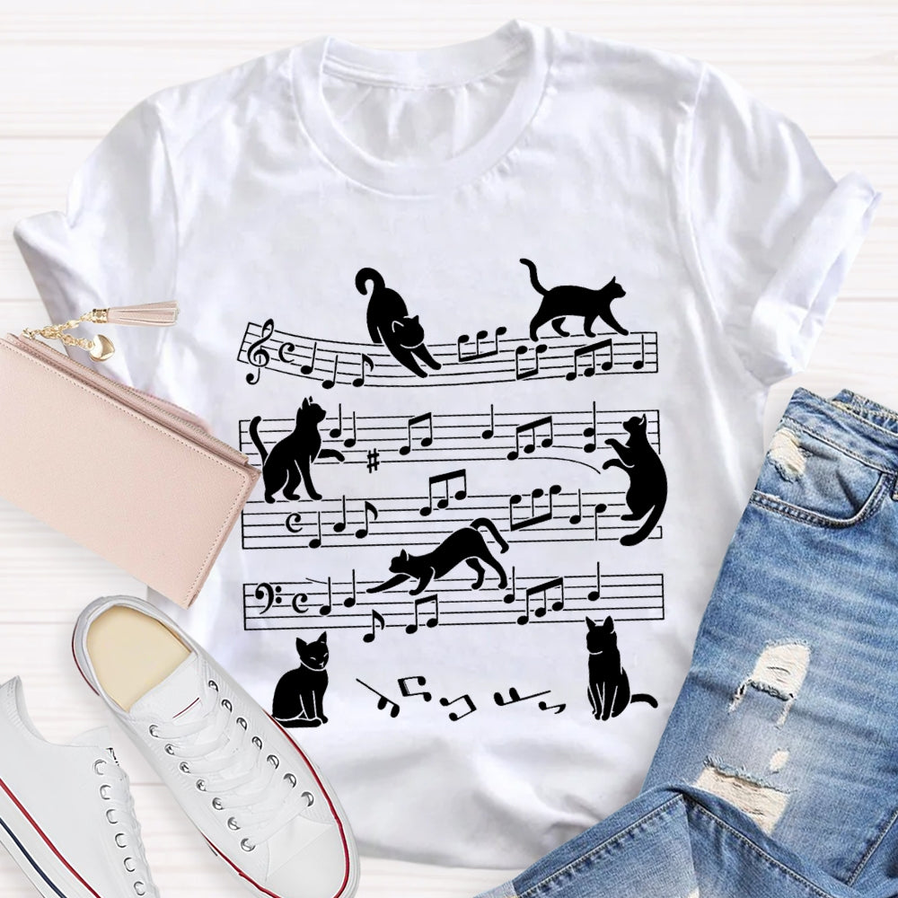A Group Of Kittens Dancing On Musical Notes Music Teacher T-shirt
