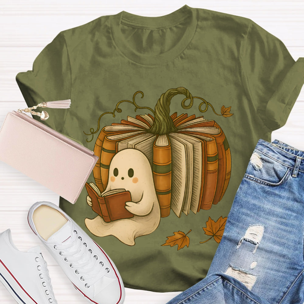 The Little Ghost Reading A Book Leans Against The Pumpkin T-shirt