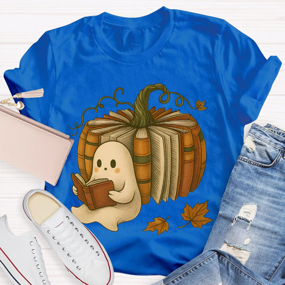 The Little Ghost Reading A Book Leans Against The Pumpkin T-shirt