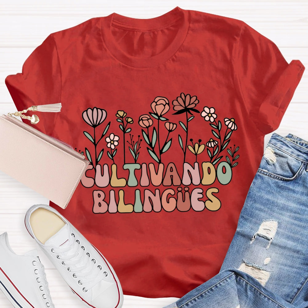 Cultivando Bilingues Colorful Fonts And Small Flowers Bilingual Teacher T-shirt