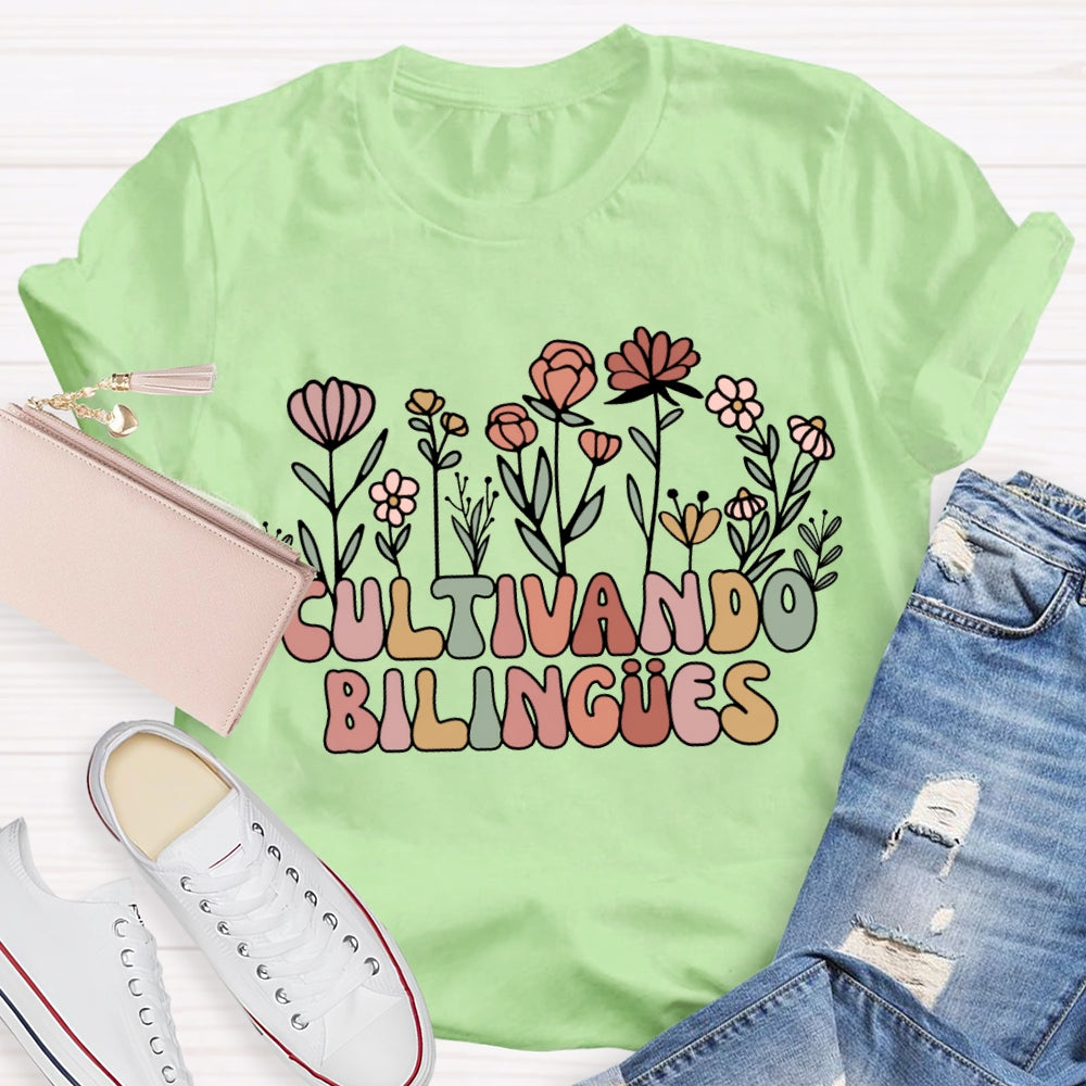 Cultivando Bilingues Colorful Fonts And Small Flowers Bilingual Teacher T-shirt