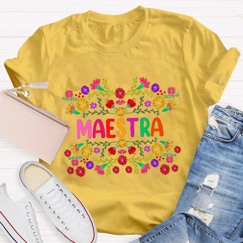 Maestra Colorful Bouquets And Colorful Fonts Bilingual Teacher T-shirt