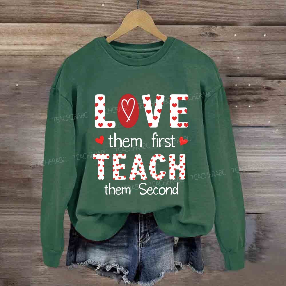 Red Heart Love Them First Teach Them Second Sweatshirt