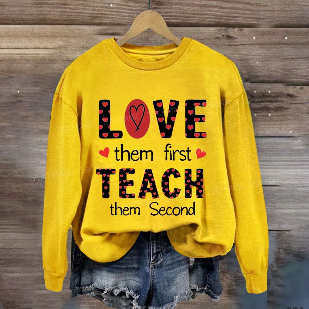 Red Heart Love Them First Teach Them Second Sweatshirt
